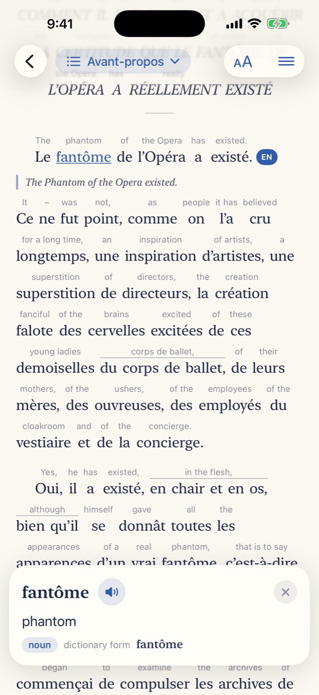 The opening of Le Fantôme de l'Opéra with English word glosses, a full sentence translation, and the word card for fantôme.